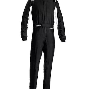 May include: Black racing suit with white accents on the shoulders and sleeves. The suit has a high collar and a belt around the waist. The brand name "Sparco" is visible on the shoulders and belt.