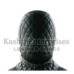 May include: Black quilted leather hood with a diamond pattern. The hood features a brown leather strap with a buckle closure around the neck. The text "Kash Enterprises LEATHER GOODS" is visible.