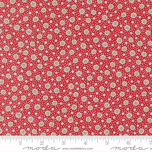 May include: Red fabric with a repeating pattern of white daisies with yellow centers and small white dots. The fabric has a ruler along the bottom edge with the word "moda" printed on it.
