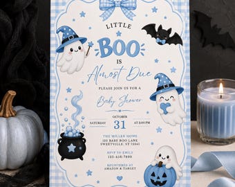 May include: A rectangular baby shower invitation with a light blue gingham border. The text reads Little Boo is Almost Due, Please Join Us For A Baby Shower, October 31 at 2:00 PM, The Miller Home, 123 Baby Boo Lane, Sweetville, ST 12345, RSVP to Emily 123-456-7890, Registered at Amazon & Target. Features include three white ghosts in blue witch hats, a black cauldron, a bat, and a blue pumpkin.