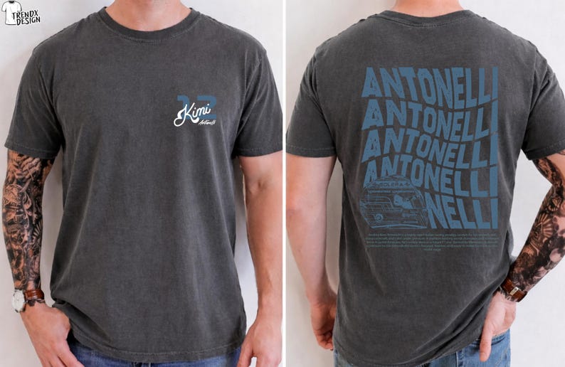 May include: Dark grey t-shirt with a small "33 Kimi Antonelli" design on the front and a large "ANTONELLI" graphic on the back, including a car illustration. The shirt has a faded, vintage appearance.