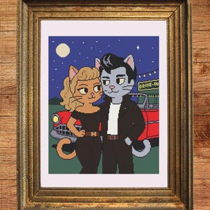 May include: Cross-stitch pattern featuring a couple of cat characters in 1950s attire, standing in front of a red car at a drive-in movie theater. The background shows a night sky with a full moon and stars. The framed artwork includes the text "Instant Download PDF".