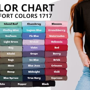 May include: A Comfort Colors 1717 color chart displaying a grid of folded t-shirts in various shades including white, ivory, banana, butter, mustard, terracotta, burnt orange, yam, grey, granite, island reef, chalky mint, seafoam, light green, bay, khaki, sage, moss, hemp, blue spruce, chambray, lagoon blue, flo blue, orchid, violet, grape, ice blue, blue jean, midnight, true navy, blossom, crunchberry, watermelon, heliconia, red, berry, brick, crimson, chili, espresso, graphite, pepper, and black.