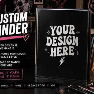 May include: A black binder with a clear front cover featuring the white text "YOUR DESIGN HERE" surrounded by star and lightning bolt icons. The binder is displayed alongside promotional text including "CUSTOM BINDER" and "YOU DESIGN IT. WE MAKE IT."