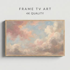 Könnte beinhalten: Ein gerahmtes Kunstwerk mit einer pastellfarbenen Wolkenlandschaft in Rosa, Pfirsich, Weiß und Grau vor einem hellblauen Himmel. Der Holzrahmen umgibt das Gemälde. Der Text oben lautet "FRAME TV ART" und "4K QUALITY."