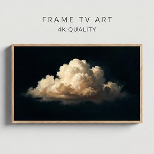 Puede incluir: Obra de arte enmarcada que presenta una gran nube iluminada sobre un fondo oscuro. La nube está representada en tonos blancos y dorados, con el texto "FRAME TV ART" y "4K QUALITY" en la parte superior. El marco es de madera clara.