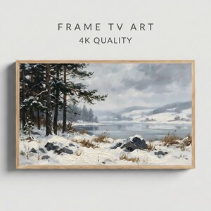 May include: A framed landscape painting of a winter scene with snow-covered trees, a lake, and hills under a cloudy sky. The artwork is in a wooden frame, with the text "FRAME TV ART" and "4K QUALITY" at the top.