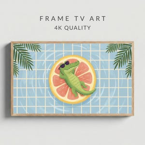 May include: A framed digital art print featuring a cartoon alligator wearing sunglasses, relaxing on a grapefruit slice in a pool. The artwork has a light blue background with a grid pattern, palm leaves, and the text "FRAME TV ART 4K QUALITY".