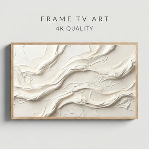 May include: A framed abstract artwork with a textured, off-white surface. The artwork features a flowing, wave-like design with visible brushstrokes. The frame is made of light-colored wood. Text on the image reads "FRAME TV ART" and "4K QUALITY".