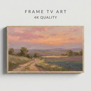 May include: A framed landscape painting with a sunset sky in shades of pink, orange, and purple. The artwork depicts a winding dirt track, fields, and trees. The text "FRAME TV ART" and "4K QUALITY" is displayed at the top.