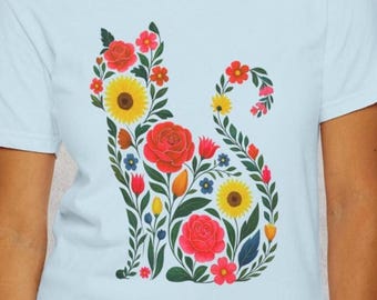 Camiseta con diseño floral de gato, ideal como regalo para amantes de las mascotas, con ilustración botánica.