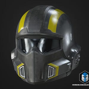 May include: A black and grey futuristic helmet with yellow detailing. The helmet has a visor, chin guard, and a skull emblem. The design includes yellow stripes and vents, suggesting a sci-fi or tactical theme.