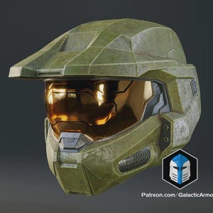 May include: A green and gold helmet with a visor. The helmet has a weathered appearance and a logo on the side. The visor is gold and reflective. The helmet is a prop or costume piece.