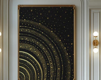 Puede incluir: Una obra de arte enmarcada con un fondo negro y un diseño dorado semicircular de círculos y puntos concéntricos cuelga de una pared blanca. La obra de arte se encuentra en un ambiente de cafetería con mesas, sillas e iluminación decorativa.