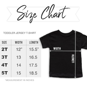 May include: A black toddler jersey t-shirt with a size chart. The chart shows sizes 2T to 5T, with corresponding width and length measurements in inches. The text "Size Chart" is at the top.