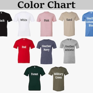 May include: A colour chart showing t-shirts in various colours. The chart includes black, white, pink, sand, and heather blue shirts. Additional colours are red, heather navy, heather athletic, forest green, and military green. The text "Color Chart" is at the top.