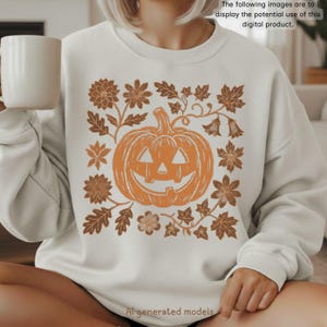 Op de afbeelding: Een crèmekleurige sweatshirt met een oranje pompoenontwerp, omringd door bruine bloemen- en bladerpatronen. De tekst "The following images are to display the potential use of this digital product." en "AI generated models" zijn ook zichtbaar.