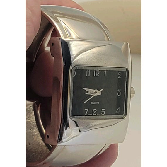 silver-tone rectangular cuff watch with a black d… - image 4