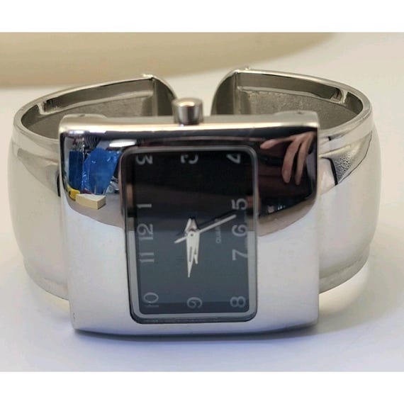 silver-tone rectangular cuff watch with a black d… - image 2