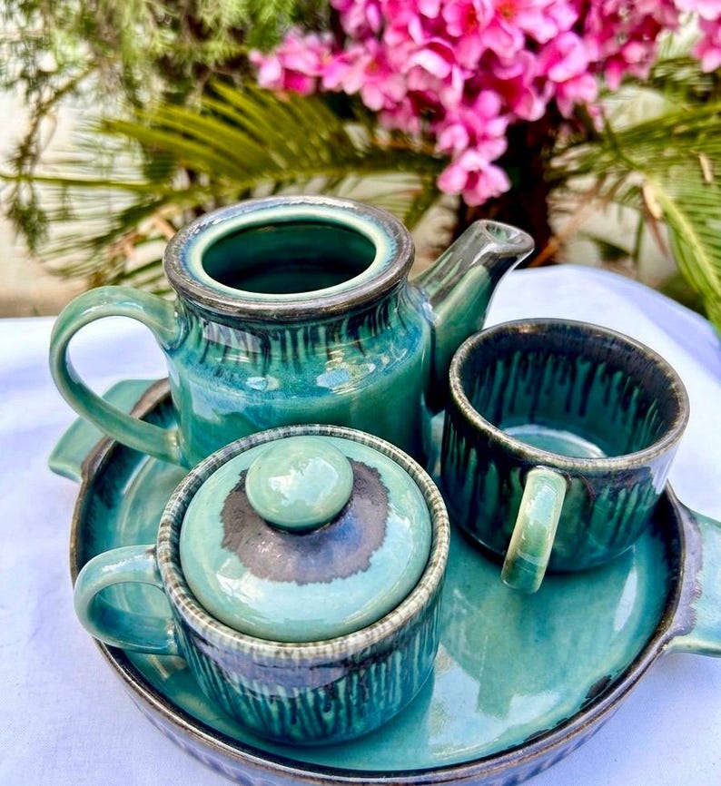 Top view handmade teal ceramic tea set teapot cups tray Khurja pottery unique glaze