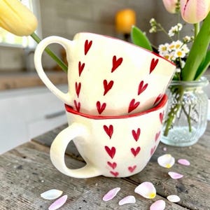 May include: A rustic wooden sign with the text "Welcome to our home" in white lettering. The sign features a distressed finish and a simple, inviting design, perfect for front door decor.