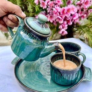 Teal ceramic teapot pouring tea handmade Khurja pottery ocean glaze tea lover gift