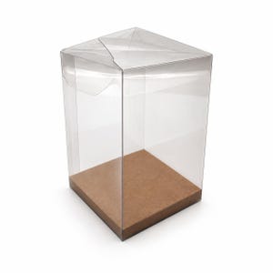 May include: A clear, rectangular plastic display box with a foldable top closure and a solid, flat brown cardboard base. The transparent walls allow for full visibility of the interior space, while the sturdy base provides a stable foundation.