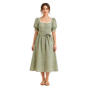 May include: A sage green midi dress with a square neckline, puff sleeves, and a button-down front. The dress features a tie waist and delicate lace trim along the neckline and sleeves. The dress is made of a lightweight fabric.