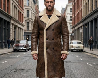 May include: A long, double-breasted brown coat with a distressed leather-like finish, featuring a wide cream-colored shearling lapel, collar, and sleeve cuffs. The coat has a structured fit with visible dark buttons down the front center.