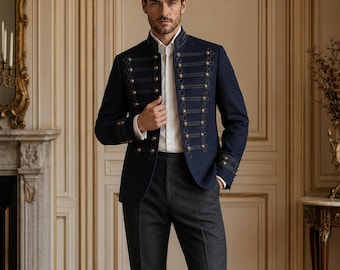 May include: A navy blue military-style jacket featuring a high mandarin collar, long sleeves, and a front closure adorned with multiple rows of decorative gold-toned buttons and intricate dark cord braiding, worn over a crisp white button-down shirt.