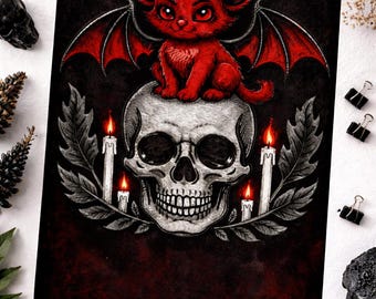 May include: A dark art print featuring a red bat-like creature with large ears and wings perched atop a detailed skull. The skull is surrounded by candles and foliage, set against a dark red and black background.