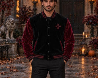 May include: A black velvet varsity jacket featuring deep red velvet sleeves, a button-front closure, and a small red embroidered emblem on the left chest. The jacket includes ribbed cuffs and a hem with red and black stripes, paired with black trousers.
