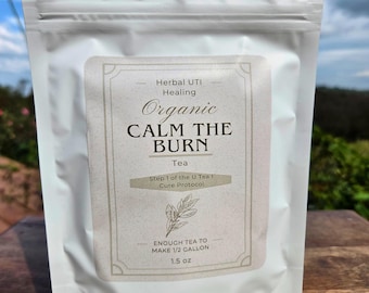 May include: A white pouch of herbal tea with a label that reads "Organic Calm the Burn Tea." The label also states "Enough tea to make 2.27 litres" and "42.5 grams."
