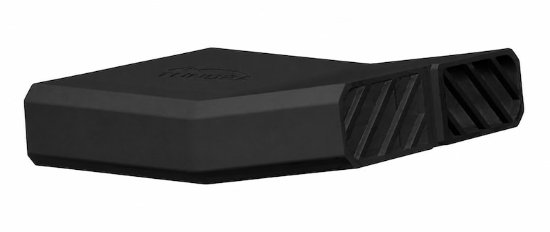 May include: A matte black automotive accessory featuring a tapered, angular design with a smooth top surface embossed with the word TUNDRA. The side profile displays two distinct rectangular sections, each containing a series of diagonal slats.