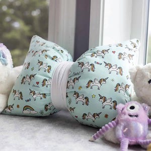 May include: A set of three ceramic mugs with a speckled, matte finish. The mugs are in shades of cream, light gray, and dark gray. Each mug has a simple, minimalist design, perfect for coffee or tea.