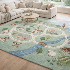 May include: A whimsical area rug featuring a town scene with roads, houses, a church, and a lighthouse. The rug includes illustrations of a dog, cat, sheep, and cow. The color palette includes shades of green, blue, and beige.