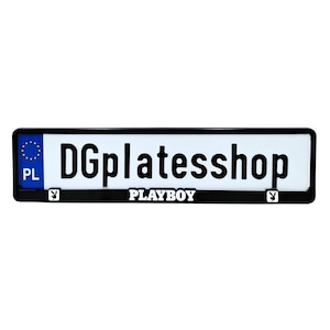 May include: A rectangular license plate with a black border. The plate has the text "DGplatesshop" in bold black letters. Below the text is the word "PLAYBOY" in white letters. The plate also features the Playboy bunny logo.