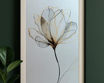 Könnte beinhalten: Gerahmter Kunstdruck mit einer filigranen Blume mit weißen Blütenblättern, umrandet in Gold und Schwarz. Das Kunstwerk ist vor einem hellen Hintergrund in Schwarz gerahmt.