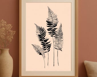 Könnte beinhalten: Gerahmter Kunstdruck mit einer Schwarz-Weiß-Illustration von Farnen. Das Kunstwerk zeigt mehrere Farnwedel vor einem hellpfirsichfarbenen Hintergrund, eingefasst in einem Holzrahmen. Das botanische Thema verleiht eine Note naturinspirierter Dekoration.
