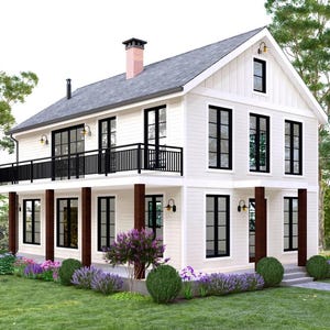 May include: A two-story white farmhouse with black window frames and a black balcony railing. The house has a gray roof and a brick chimney. Landscaping includes green grass, bushes, and purple flowers.