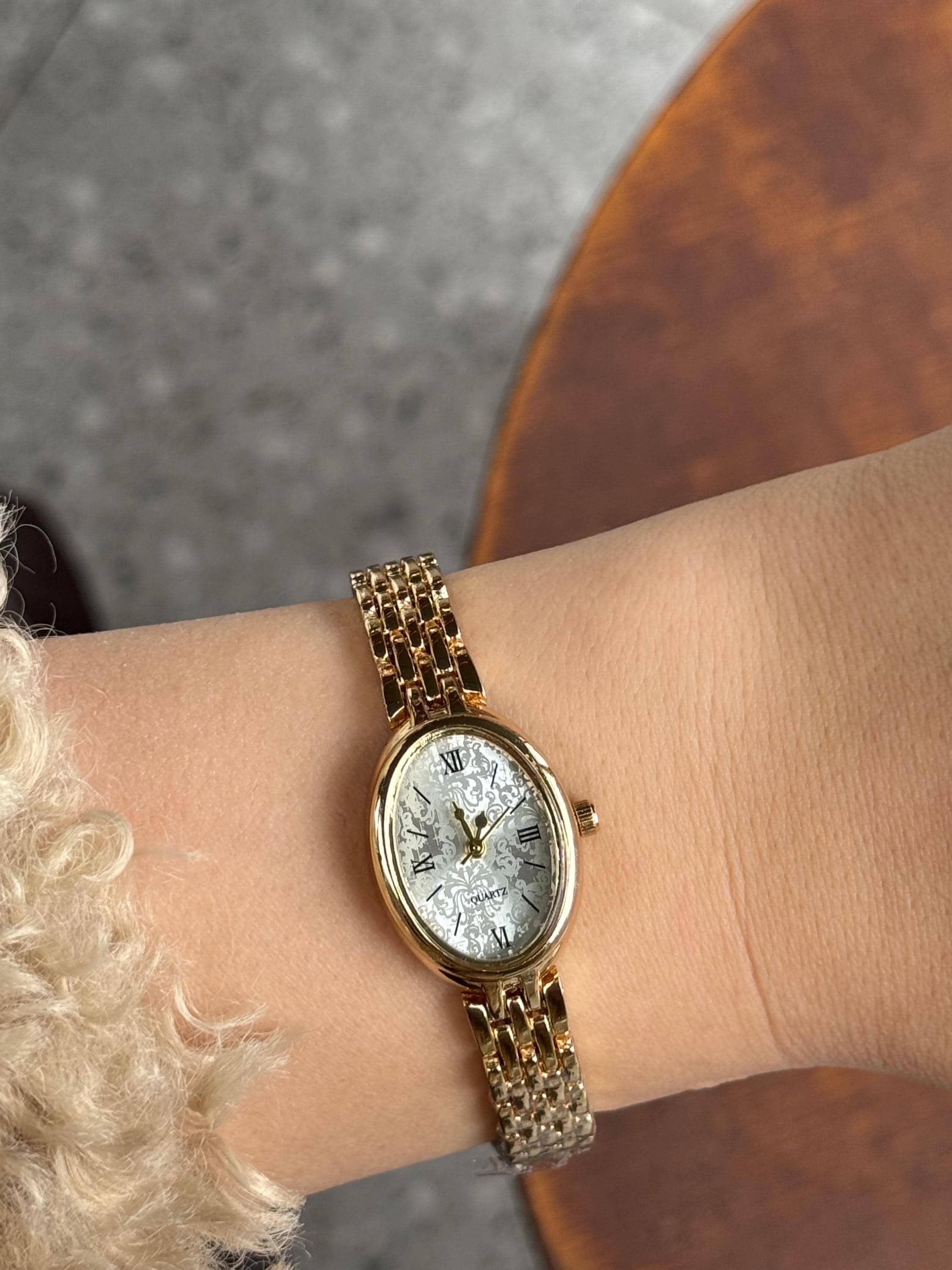 Oval Gold Tone Women Watch: Roman Numeral, Elegant Bracelet 