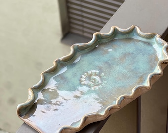 Keramische lepelhouder in turquoise – handgemaakt, uniek stuk voor in de keuken.