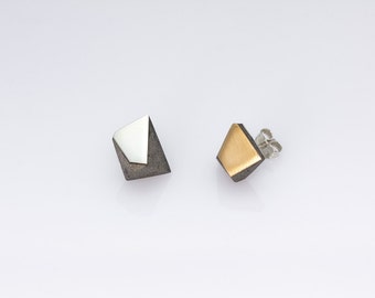 Concrete, sterling silver and bronze earrings.