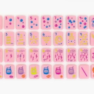 May include: A collection of rectangular pink tiles arranged in four rows. The tiles feature various colorful illustrations including numbers one through nine, weather patterns, food items, and letters. Each tile has a smooth, flat surface.