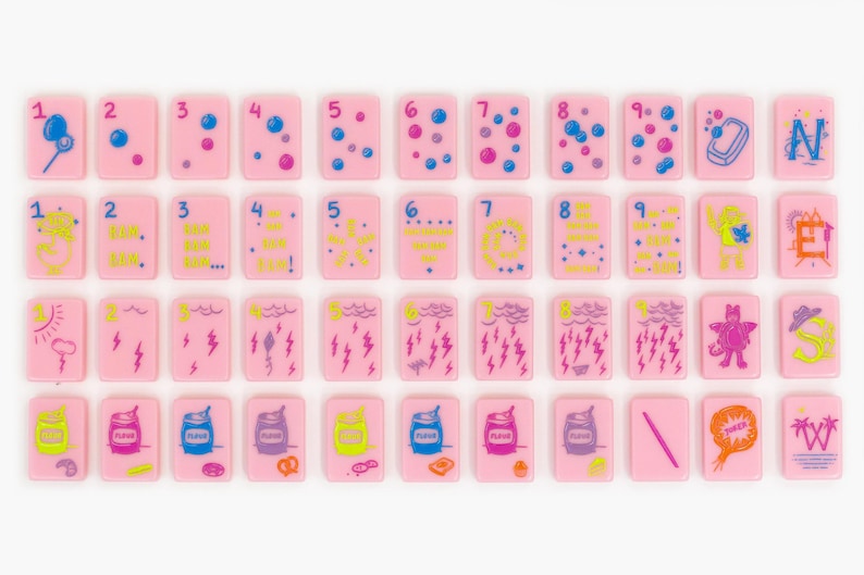May include: A collection of rectangular pink tiles arranged in four rows. The tiles feature various colorful illustrations including numbers one through nine, weather patterns, food items, and letters. Each tile has a smooth, flat surface.