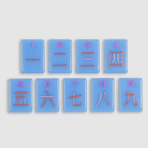 May include: Nine rectangular light blue tiles arranged in two rows. Each tile features a pink Arabic numeral at the top and a corresponding orange Chinese character for numbers one through nine centered below the numeral on the tile surface.