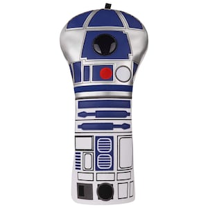 May include: A golf club head cover designed to resemble the Star Wars character R2-D2. The cover features a blue, silver, and white color scheme with detailed graphics. The top has a blue dome, and the body has rectangular and circular designs.