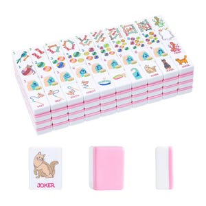 May include: A set of white and pink mahjong tiles featuring colorful illustrations of cats, yarn balls, bones, and various symbols. The tiles are arranged in a rectangular stack, with individual tiles showing cat graphics and the word JOKER.