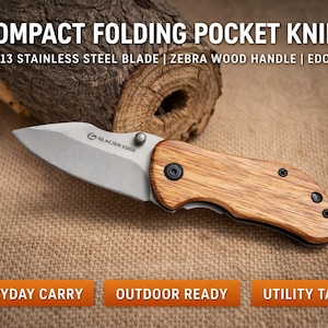 May include: A compact folding pocket knife with a stainless steel blade and zebra wood handle. The knife features the text "COMPACT FOLDING POCKET KNIFE" and "3CR13 STAINLESS STEEL BLADE | ZEBRA WOOD HANDLE | EDC TOOL". The knife is designed for everyday carry, outdoor use, and utility tasks.