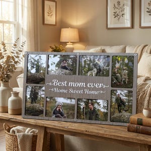 May include: A gray wooden multi-photo frame with eight openings, each holding a different photograph. The frame has the text "Best mom ever Home Sweet Home" in white script. The frame is displayed on a wooden table.